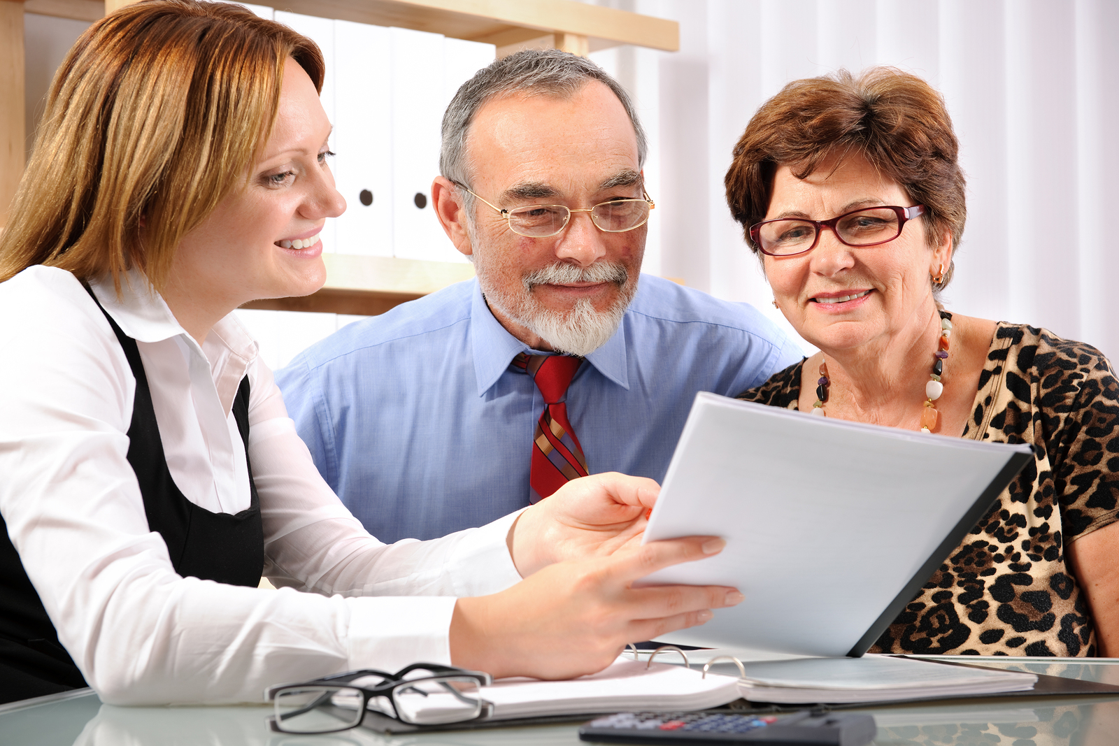Senior couple meeting with agent or advisor
